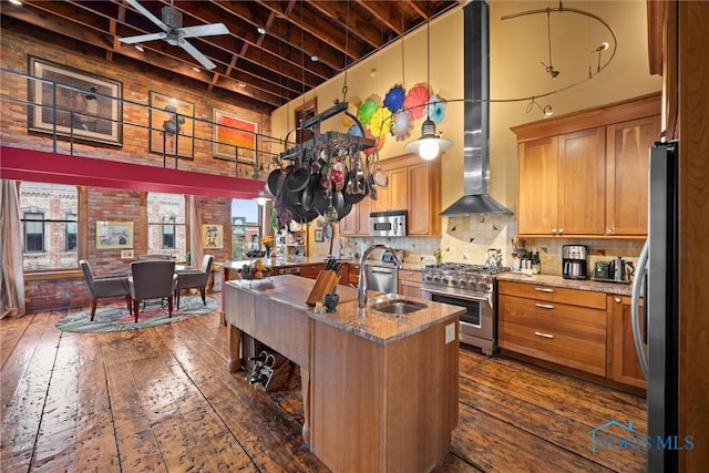 1 S Saint Clair St, Toledo, OH 43604 - kitchen featuring dark wood-style flooring, a high ceiling, a sink, and appliances with stainless steel finishes