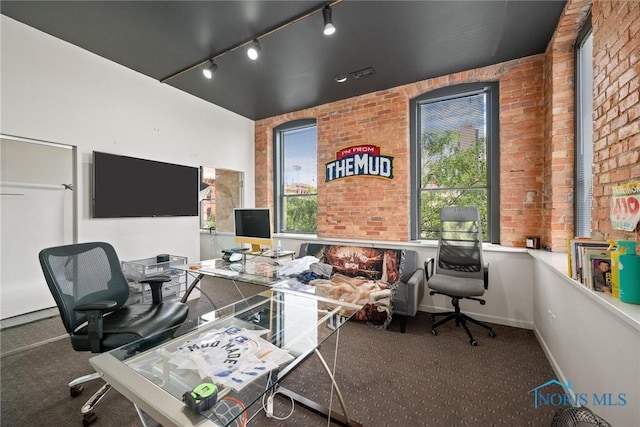 1 S Saint Clair St, Toledo, OH 43604 - office area featuring brick wall, carpet floors, baseboards, and track lighting
