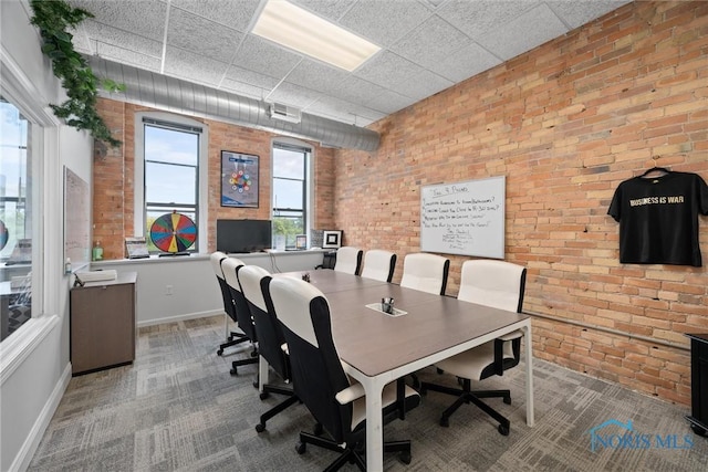 1 S Saint Clair St, Toledo, OH 43604 - office space featuring baseboards, a paneled ceiling, carpet, and brick wall