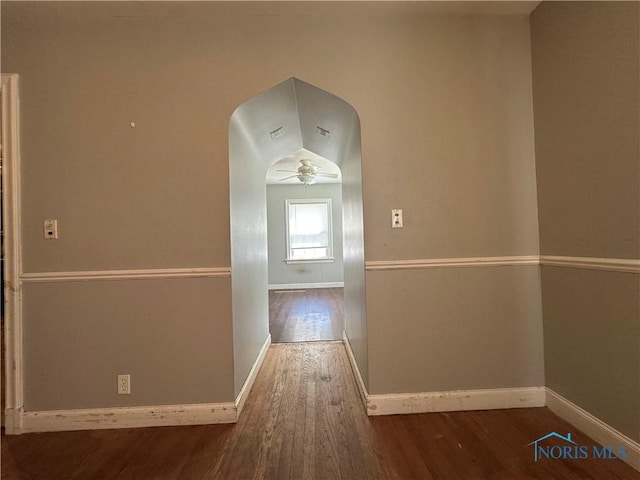 940 N Main St, Fostoria, OH 44830 - hallway with wood finished floors, baseboards, and arched walkways