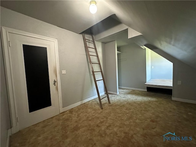 940 N Main St, Fostoria, OH 44830 - additional living space featuring carpet flooring, vaulted ceiling, and baseboards