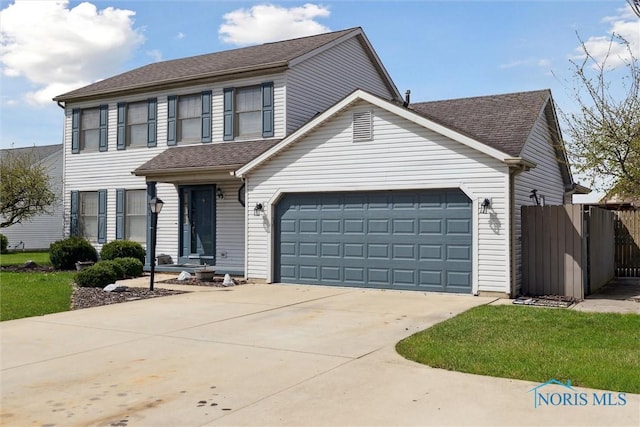 view of front of house with driveway, fence, a garage, and roof with shingles