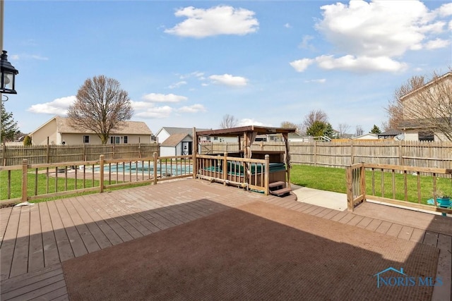 wooden deck with a fenced in pool, a yard, a residential view, and a fenced backyard