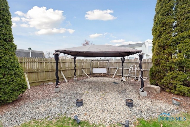 view of yard featuring a gazebo and fence
