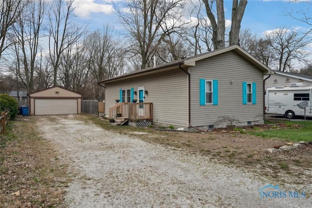 view of side of property with crawl space, an outdoor structure, and a detached garage