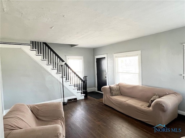 16 College Pl, Defiance, OH 43512 - living area featuring wood finished floors, a wealth of natural light, and stairway