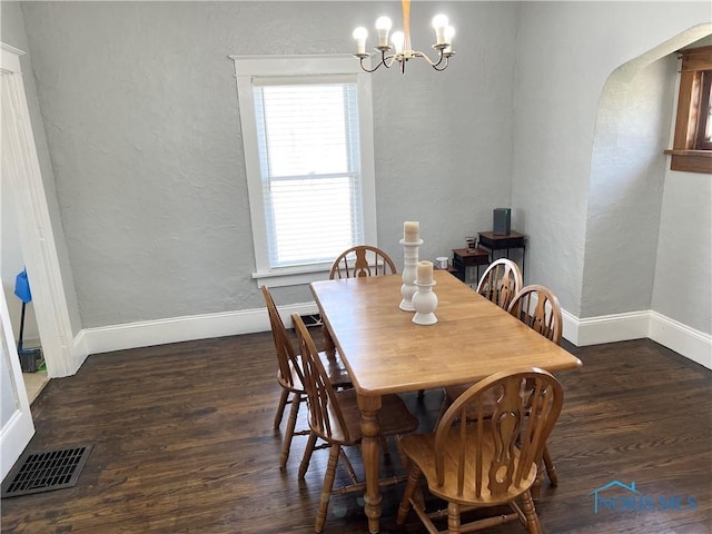 16 College Pl, Defiance, OH 43512 - dining area featuring visible vents, a wealth of natural light, a chandelier, and wood finished floors