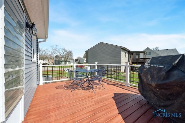 5808 President Dr, Toledo, OH 43611 - wooden terrace featuring a residential view, outdoor dining space, and area for grilling