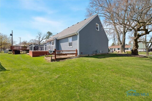 5808 President Dr, Toledo, OH 43611 - back of house with a lawn and a wooden deck