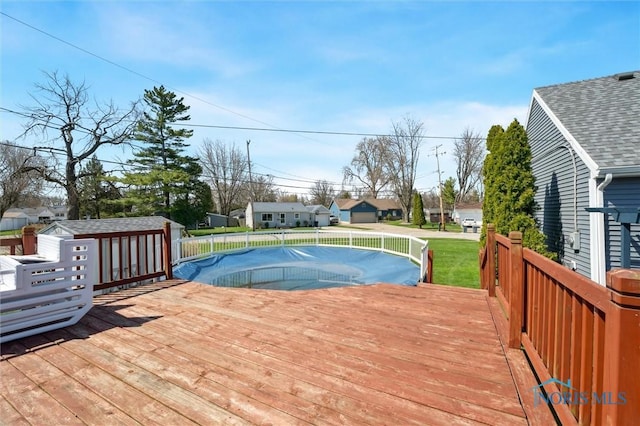 5808 President Dr, Toledo, OH 43611 - view of pool featuring an outdoor structure, a residential view, a shed, and a deck