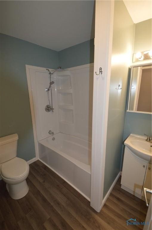 1964 Sudbury Dr, Holland, OH 43528 - full bath with vanity, baseboards,  shower combination, toilet, and wood finished floors