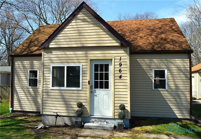 1964 Sudbury Dr, Holland, OH 43528 - rear view of house with a shingled roof
