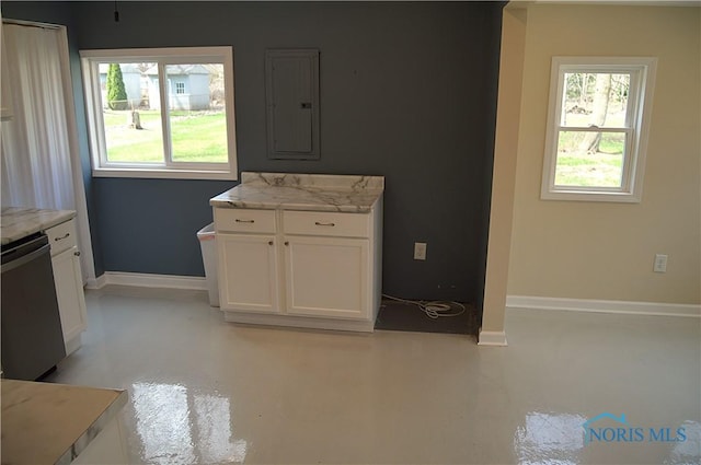 1964 Sudbury Dr, Holland, OH 43528 - kitchen featuring baseboards, light stone counters, electric panel, white cabinets, and dishwashing machine