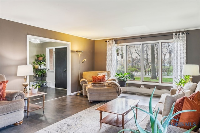 living room with baseboards, ornamental molding, and wood finished floors