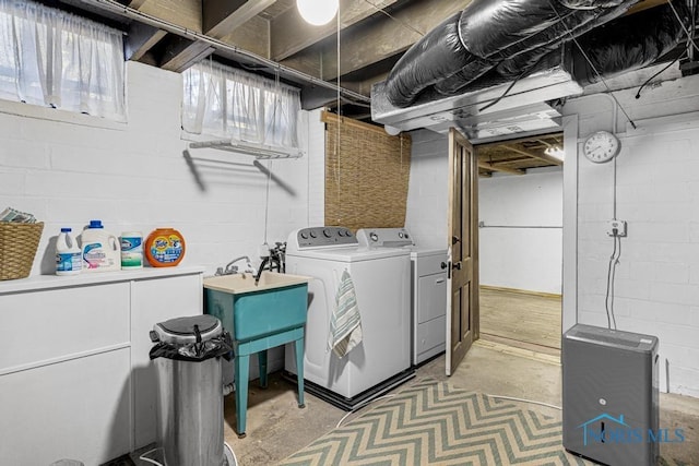 washroom featuring washer and dryer and laundry area
