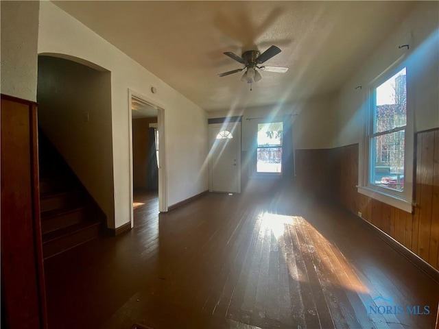 715 Raymer Blvd, Toledo, OH 43605 - additional living space with arched walkways, a ceiling fan, hardwood / wood-style flooring, and a wealth of natural light