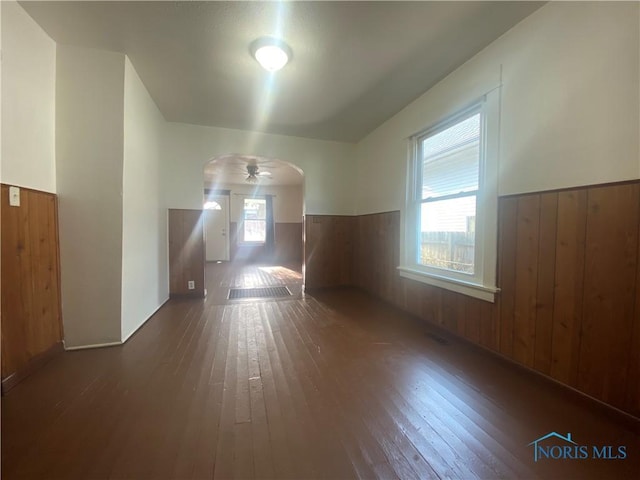 715 Raymer Blvd, Toledo, OH 43605 - bonus room with arched walkways, wood-type flooring, wooden walls, and a wainscoted wall