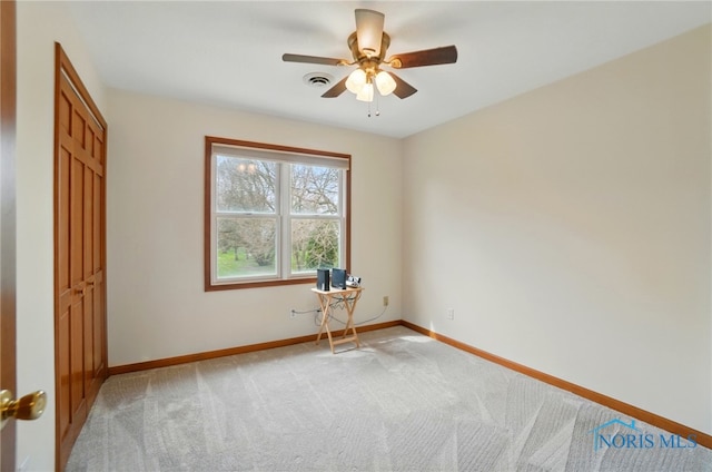 unfurnished bedroom with visible vents, baseboards, ceiling fan, and light carpet
