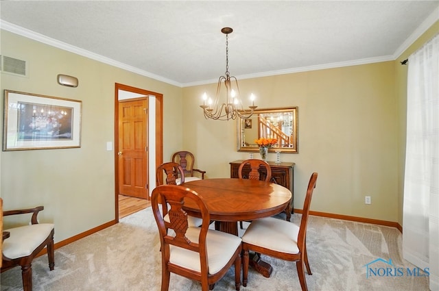 dining room with ornamental molding, visible vents, light colored carpet, and a notable chandelier