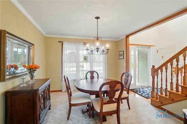 dining room featuring stairway, plenty of natural light, and an inviting chandelier
