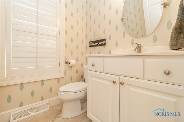 bathroom with toilet, visible vents, wallpapered walls, tile patterned flooring, and vanity
