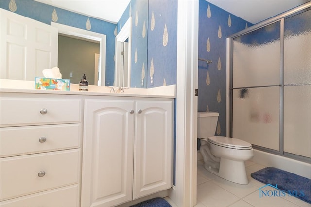 full bath with vanity, tile patterned flooring, a stall shower, and toilet