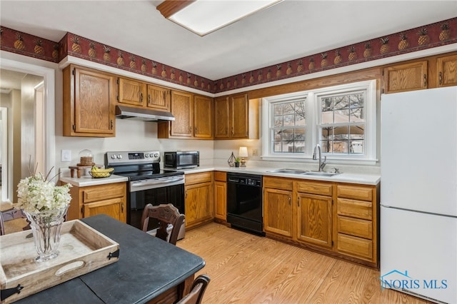 242 E Yates Ave, Findlay, OH 45840 - kitchen featuring black dishwasher, freestanding refrigerator, electric range, a sink, and under cabinet range hood