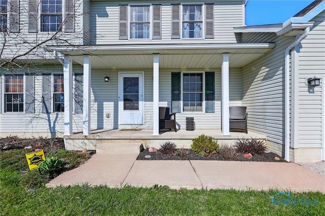 doorway to property featuring covered porch