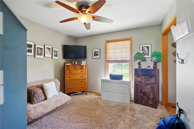 carpeted bedroom featuring ceiling fan and baseboards