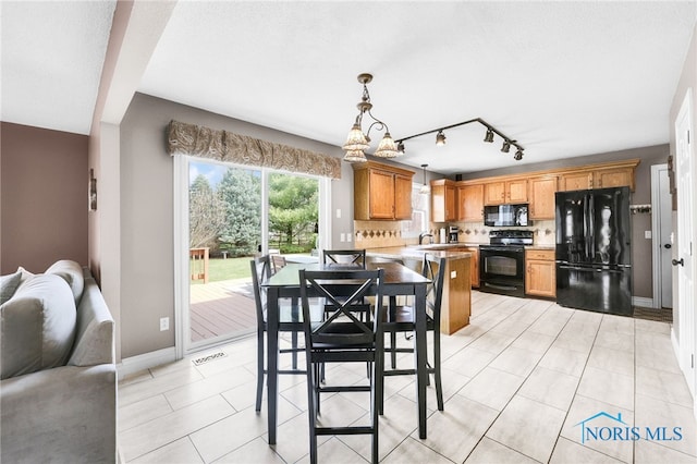 1605 Eaglecrest Rd, Perrysburg, OH 43551 - dining room featuring track lighting, light tile patterned floors, baseboards, and visible vents