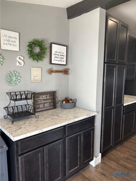 bar featuring dark wood-style flooring