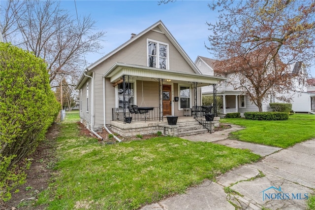 416 Cherry St, Findlay, OH 45840 - view of front of home featuring a porch and a front yard