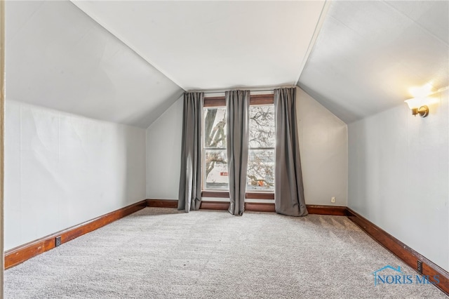 416 Cherry St, Findlay, OH 45840 - additional living space featuring vaulted ceiling, carpet floors, and baseboards