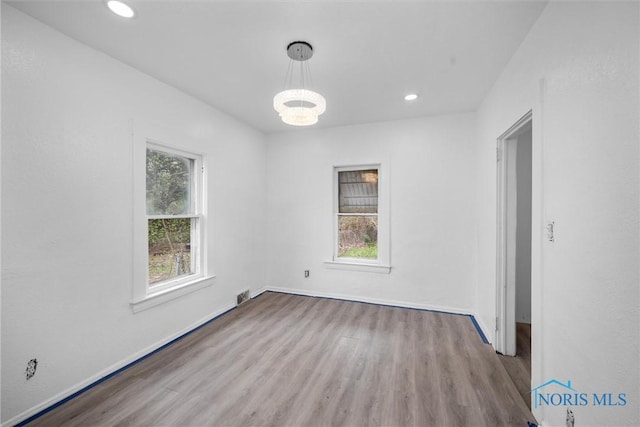 3251 Cottage Ave, Toledo, OH 43608 - interior space featuring baseboards, wood finished floors, visible vents, and recessed lighting