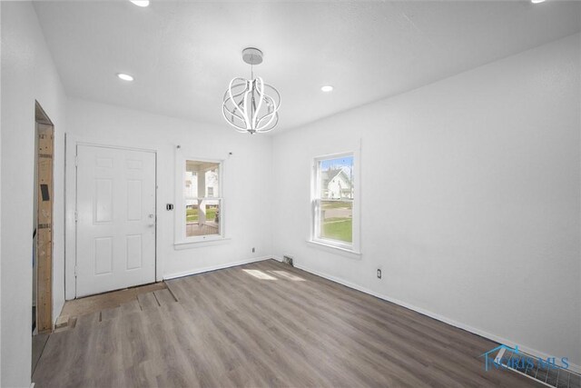 3251 Cottage Ave, Toledo, OH 43608 - interior space featuring recessed lighting, wood finished floors, baseboards, and an inviting chandelier