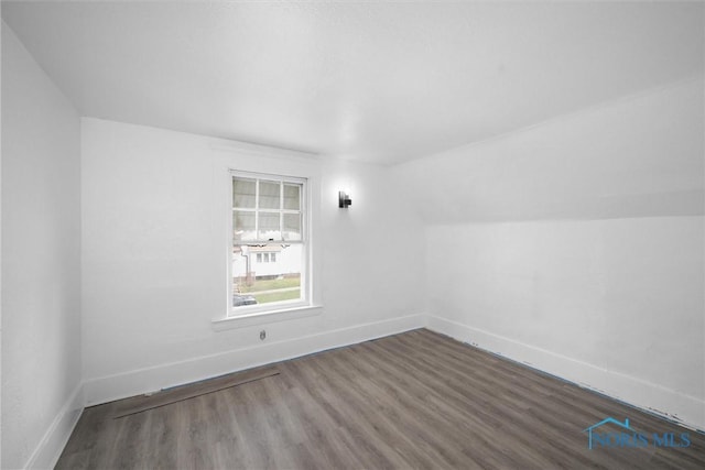 3251 Cottage Ave, Toledo, OH 43608 - bonus room with vaulted ceiling, baseboards, and wood finished floors