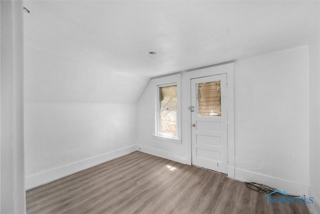 3251 Cottage Ave, Toledo, OH 43608 - entryway featuring baseboards, lofted ceiling, and wood finished floors