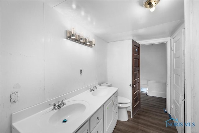 3251 Cottage Ave, Toledo, OH 43608 - full bath with toilet, wood finished floors, a sink, and double vanity