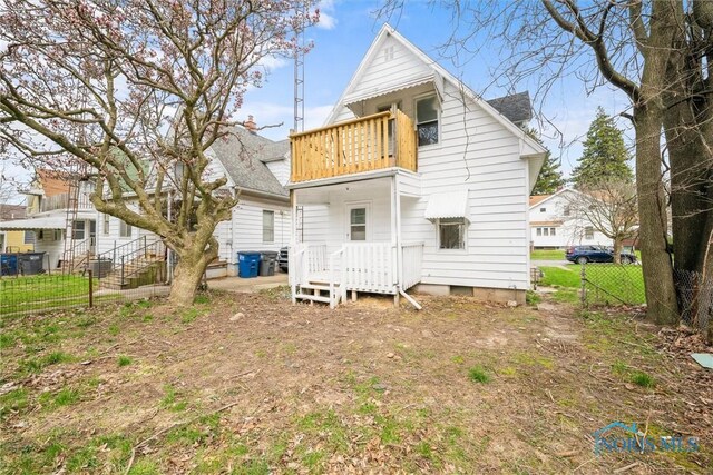 3251 Cottage Ave, Toledo, OH 43608 - back of house with fence and a balcony