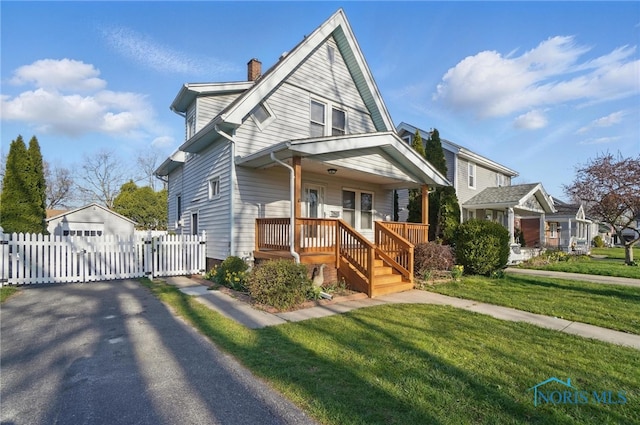 bungalow-style home with a gate, a chimney, a front lawn, covered porch, and fence