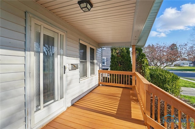 wooden terrace with a porch