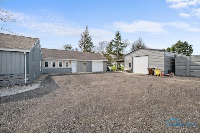 detached garage featuring driveway