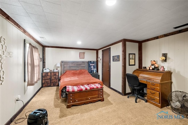 carpeted bedroom with baseboards and crown molding