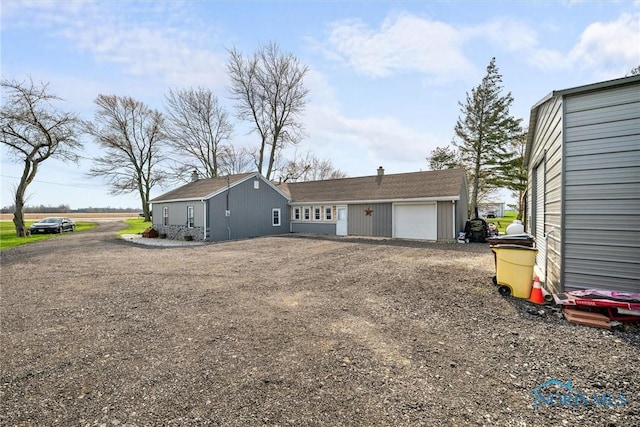 exterior space with dirt driveway