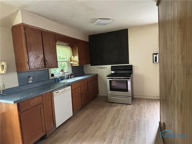 432 S Squire St, Holgate, OH 43527 - kitchen with stainless steel range with electric cooktop, dishwasher, light wood-type flooring, a sink, and brown cabinetry