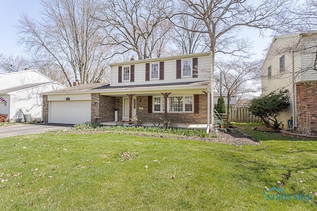traditional-style home with concrete driveway, covered porch, a garage, brick siding, and fence