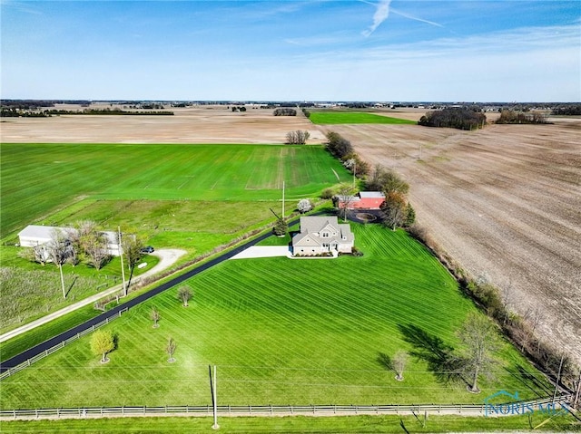 birds eye view of property with a rural view