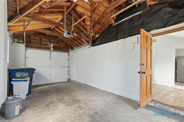 3105 W Laskey Rd, Toledo, OH 43613 - garage with visible vents and a garage door opener