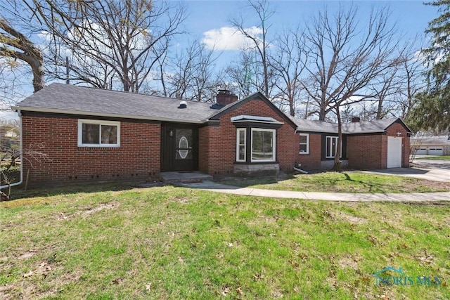 3105 W Laskey Rd, Toledo, OH 43613 - single story home featuring brick siding, a chimney, a front yard, and concrete driveway