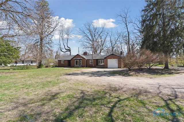 3105 W Laskey Rd, Toledo, OH 43613 - ranch-style home featuring a chimney, a front lawn, dirt driveway, and an attached garage